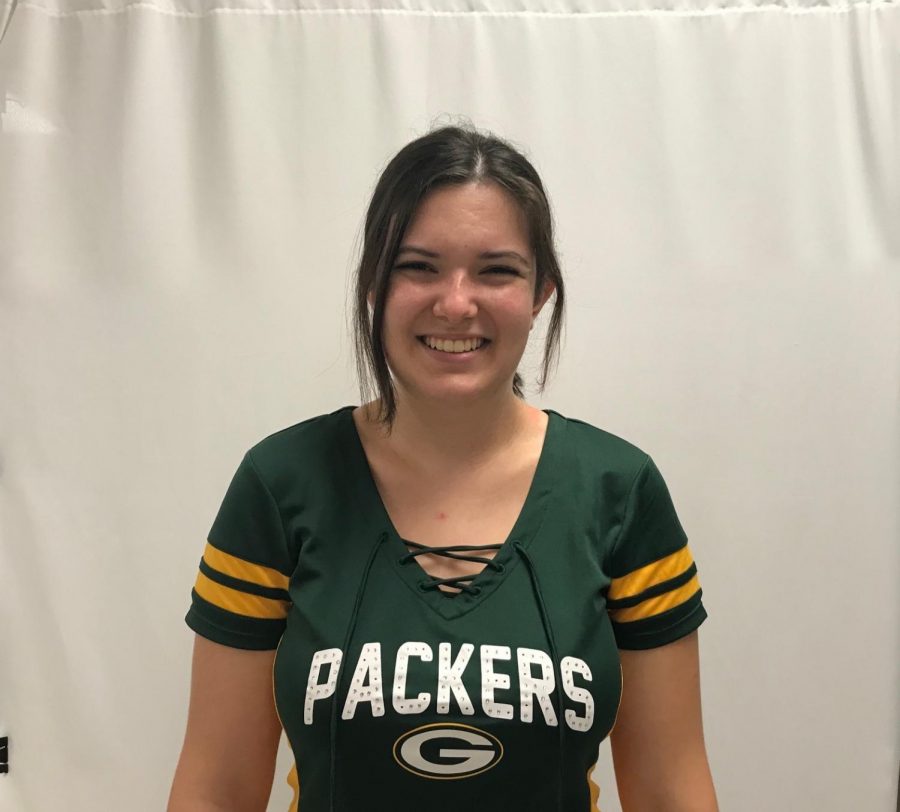 A Green Bay fan since birth, Gracie Martin (22) roots for the Packers with her Wisconsin family. 