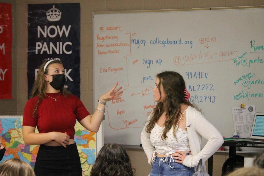 Sofia Chianella (23) and Brooke Ealy (23) lead their fellow GEM club members through an informational presentation at the first club meeting on Aug. 25.
Photo provided by: Kole Kemple