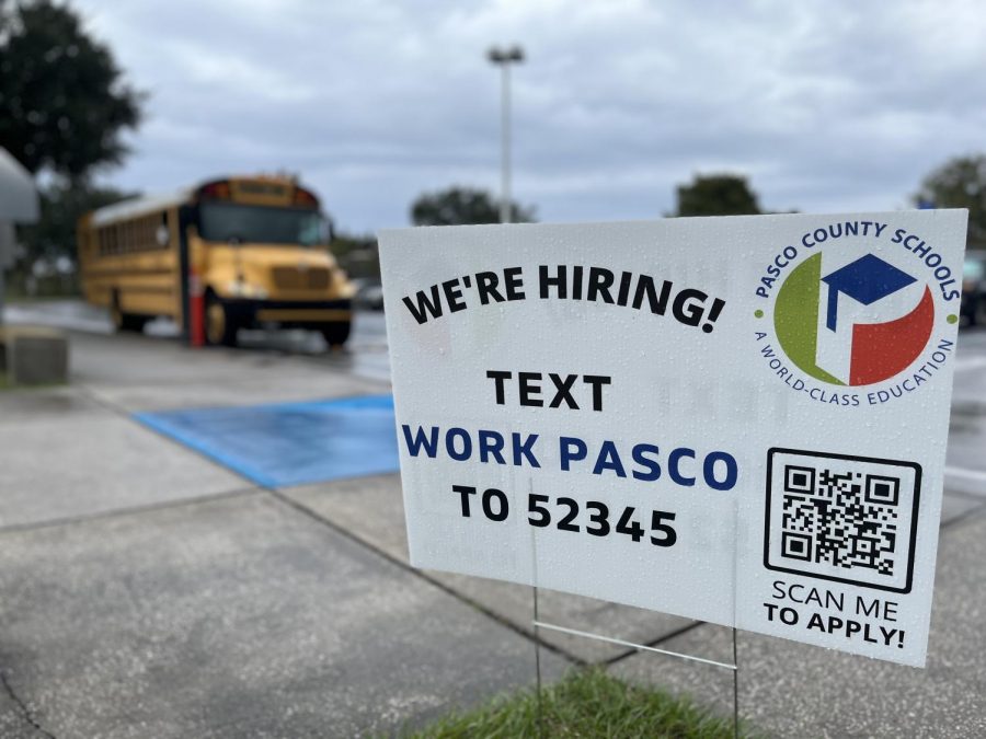 A sign advertising jobs rests near the JWMHS bus pick up loop. By S. McNulty