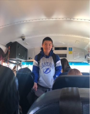Jacob Flynn (‘24) boards bus 714, heading to his seat after school. He squeezes through the narrow and crowded walkway.