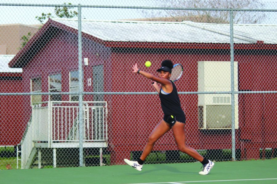 On Feb. 15, Ava Mance returns a volley against her Wesley Chapel Wildcat opponent. 