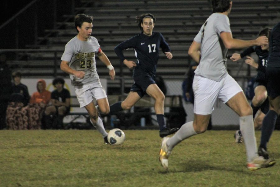 During the game on Jan. 17, Dominick Phanco (’22) rushes to get the ball from a Land o’ Lakes player for another chance to score a goal.