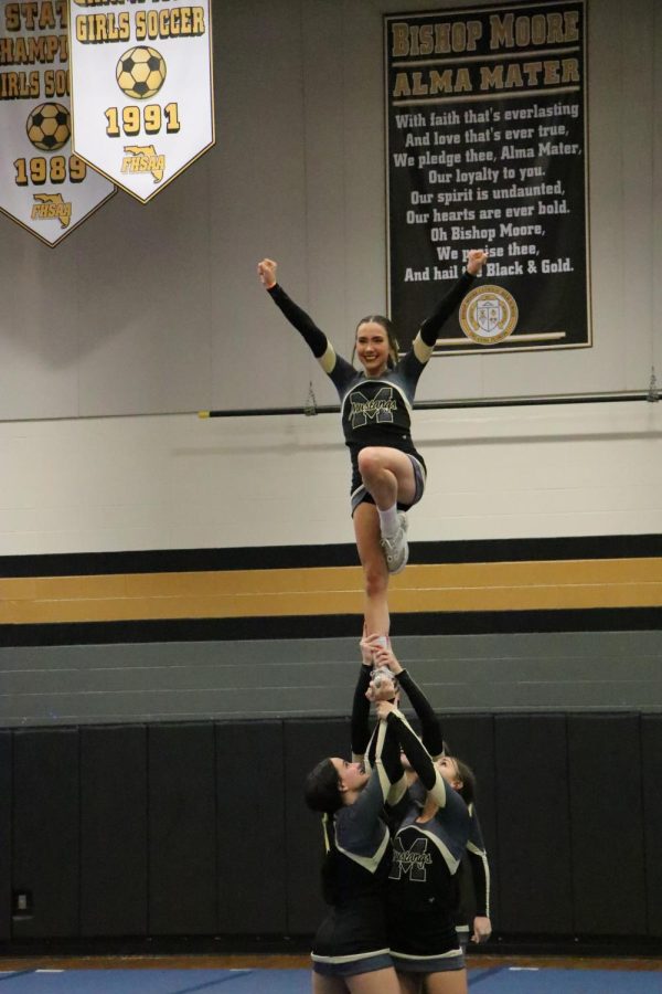 With passion and determination, a cheerleader flies high