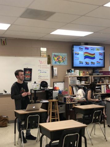 Elijah Daniel (22) stood in front of GEM members while he discussed the different flags that represent the individual members of the LGBTQIA+ community. 