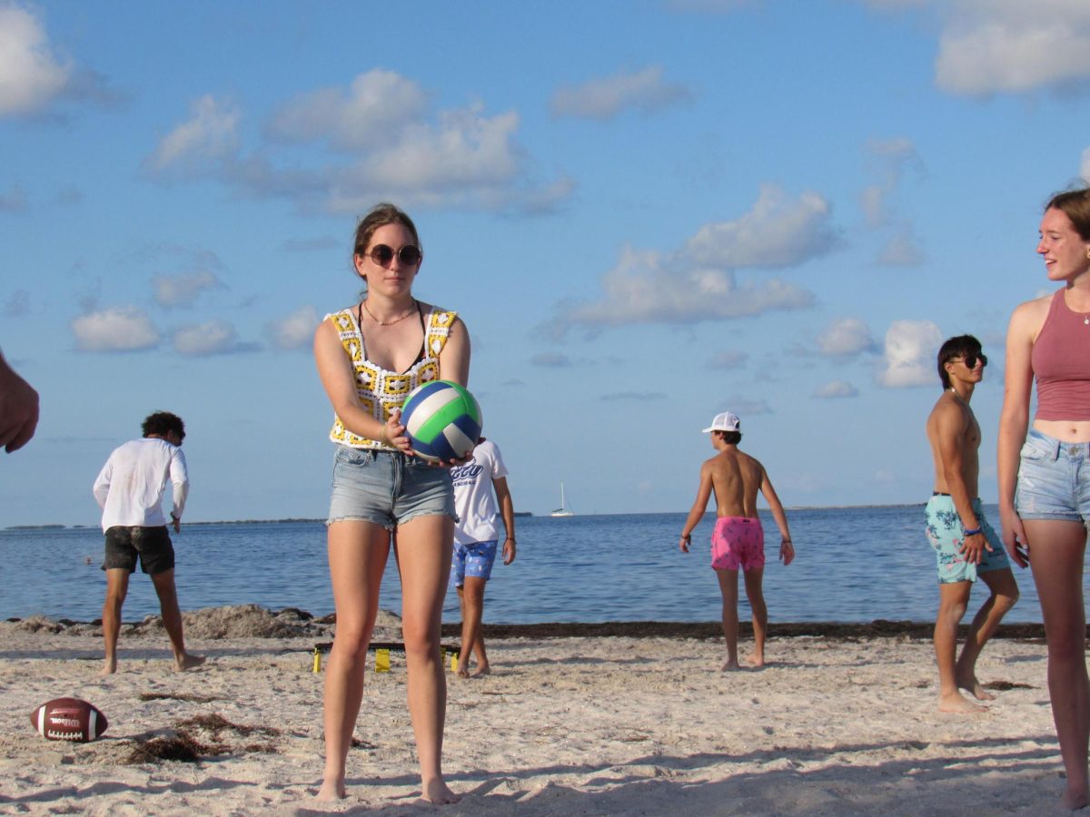 Playing+volleyball+with+their+friends%2C+Alexandra+and+Evann+Pippio+%28%E2%80%9924%29+take+turns+serving+the+ball+during+their+game.+Even+after+the+sun+came+up%2C+memories+were+still+being+made.+%E2%80%9CIt+was+a+great+way+to+end+the+summer%2C%E2%80%9D+Pippio+said.