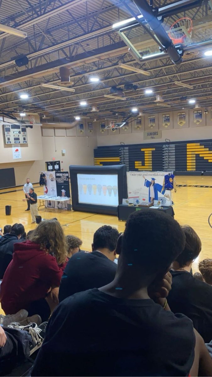 10th grade students watch the presentation in the Gym after getting released from class during 1st period. 