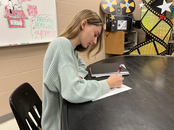 A student works on her study guide in Mr. Scotts class