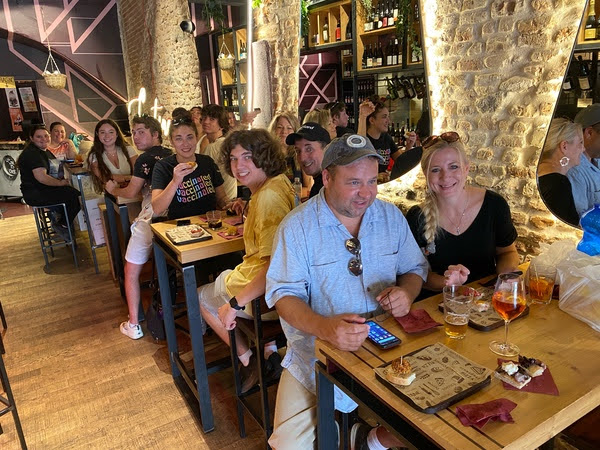 In the streets of Padua, Italy, Ms. Schulaski sits with her group of 18 in a cafe to escape the summer heat. She led this group to 4 different countries, experiencing activities from gondola rides, glass-blowing demonstrations, and folklore plays.