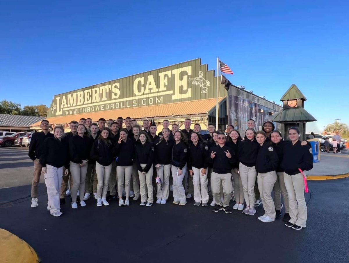 The Mitchell NJROTC unit poses in front of a restaurant in the Pensacola before a national competition. Madison Toner (24) had some words of encouragement for the unit, I think the unit will make it back to nationals next year, each year they keep getting better and better and i have full faith theyll make it again and place even better then this year, Toner said.