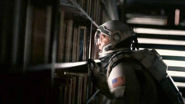 The "bookshelf scene" in Interstellar (2014), starring Matthew McConaughey as Joseph Cooper. Photo from Christopher Nolan's Interstellar.